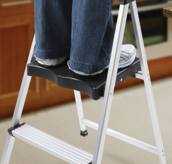 Person standing on ladder